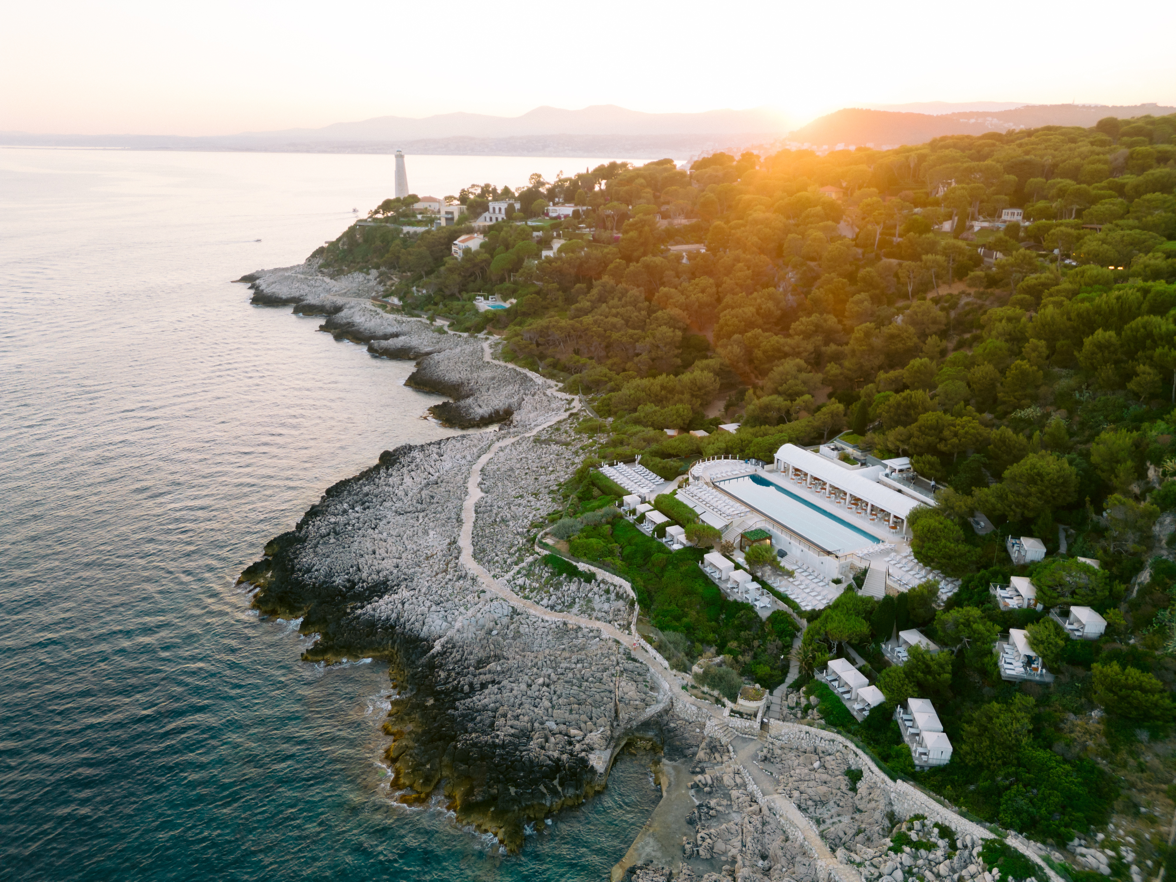 Cap Ferrat lighthouse and pool at golden hour